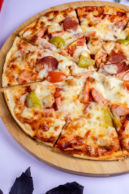 Pizza with vegetables and sausages