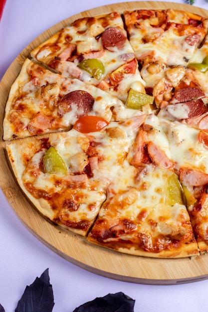 Pizza with vegetables and sausages