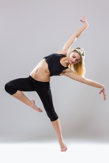 Pj-dance, young beautiful dancer posing on a studio isolated on white background