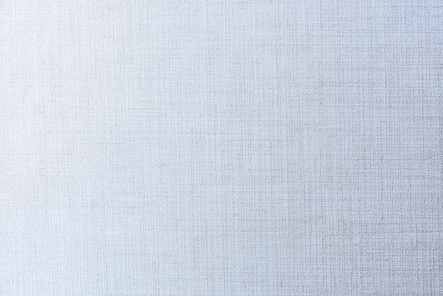 Free photo plain faded blue matt weave fabric textured background
