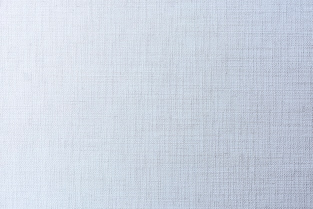 Plain faded blue matt weave fabric textured background