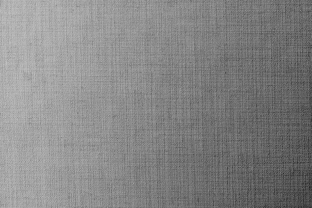 無地の灰色の生地の織り目加工の背景