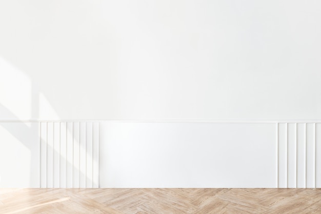 Plain white wall with a parquet floor