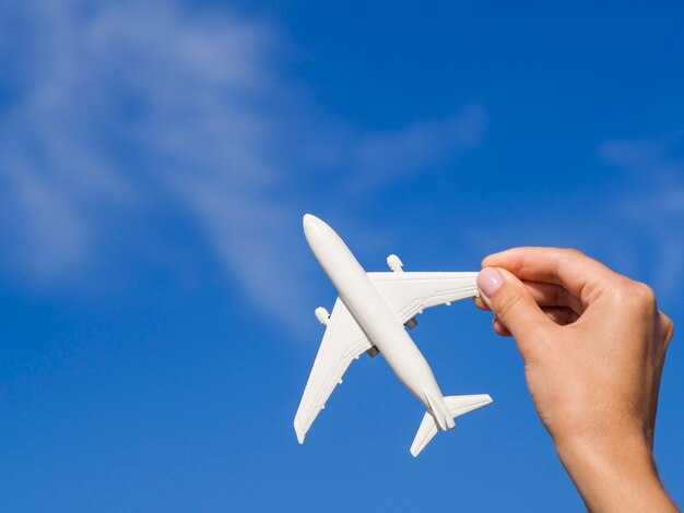 Plane being hold by a hand