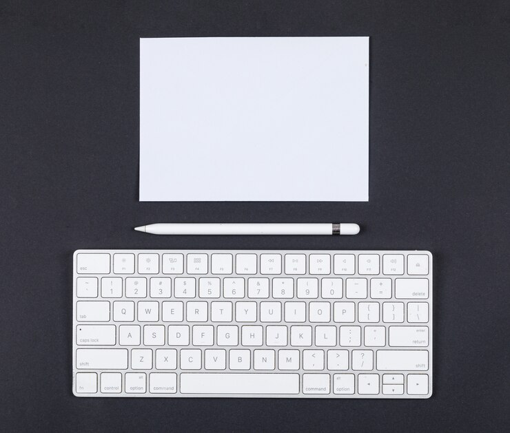 Free Photo planning concept with pencil, keyboard, paper on black background top view. space for text. horizontal image
