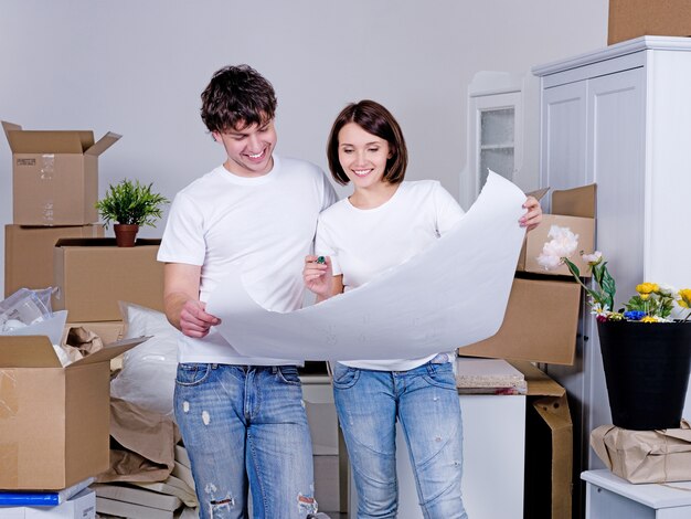 Planning future flat by young cheerful couple