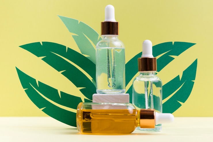 Free Photo plant leaves with serum bottles