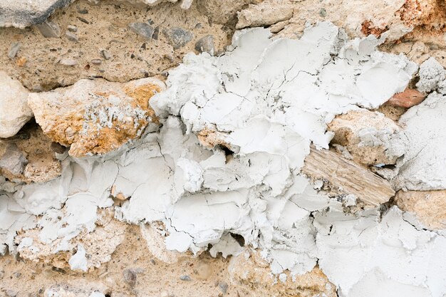 Free photo plaster and rocks on rough surface