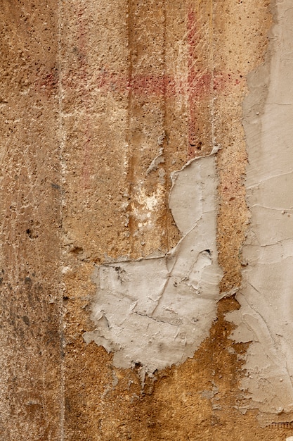Plaster on rough concrete wall