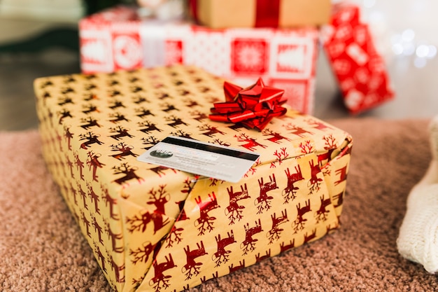 Plastic card and present boxes on carpet