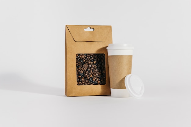 Plastic cup next to coffee bag