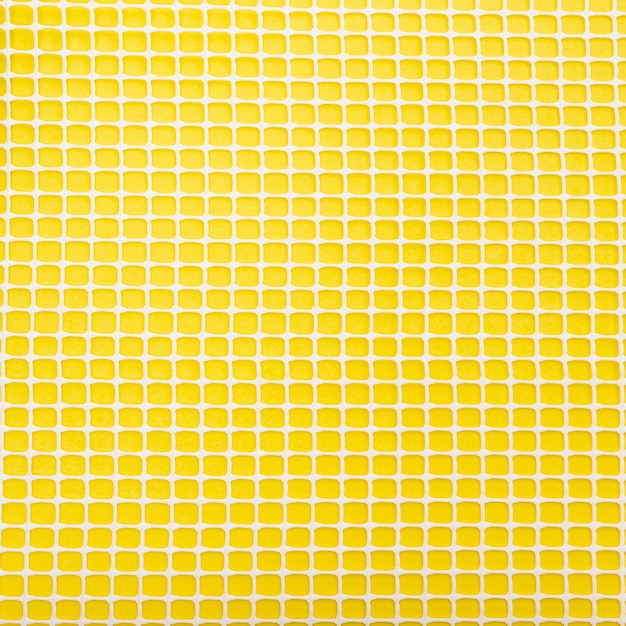 Plastic net on yellow background