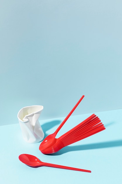 Free photo plastic red cutlery and cup