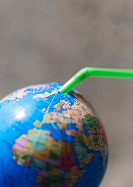 Plastic straw in globe