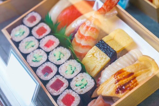 Free photo plastic sushi rolls in a display case