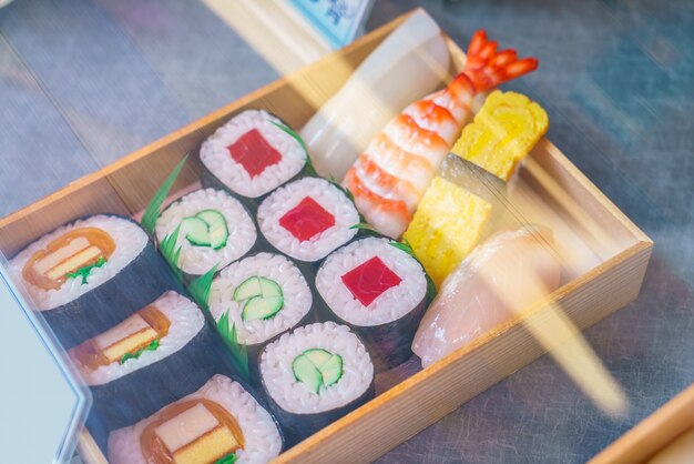 Plastic Sushi rolls in a display case