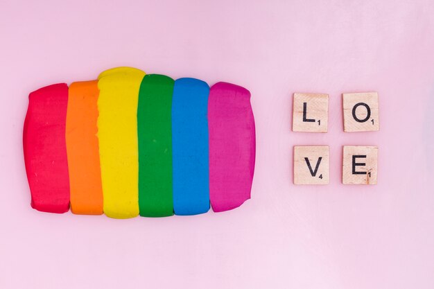 Plasticine sticks and text wooden blocks with word love