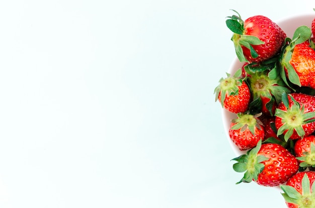 Plate of bright ripe strawberry fruit