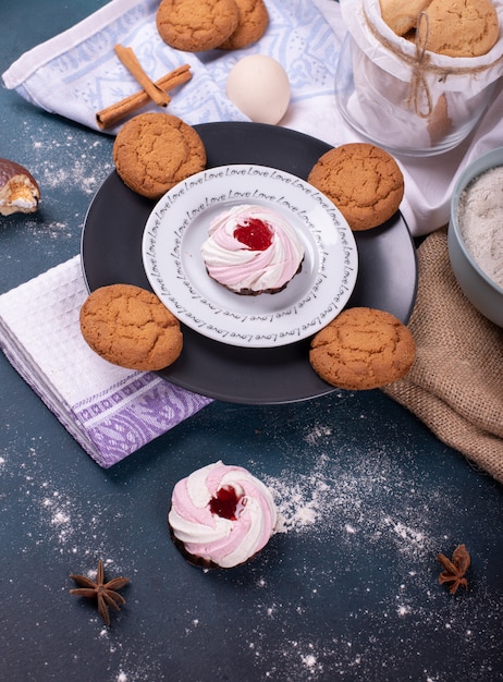 Plate of cake and biscuits and flour