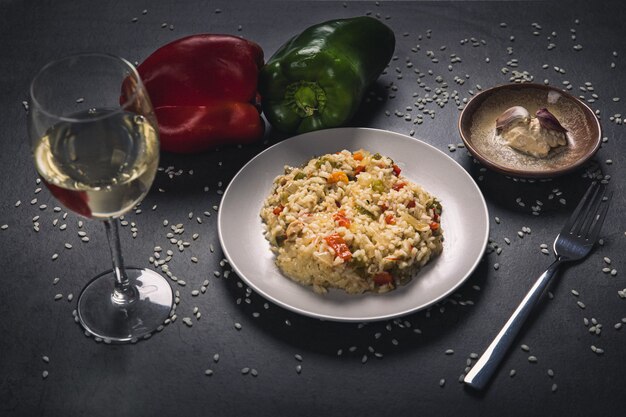 Plate of fried rice served with white wine