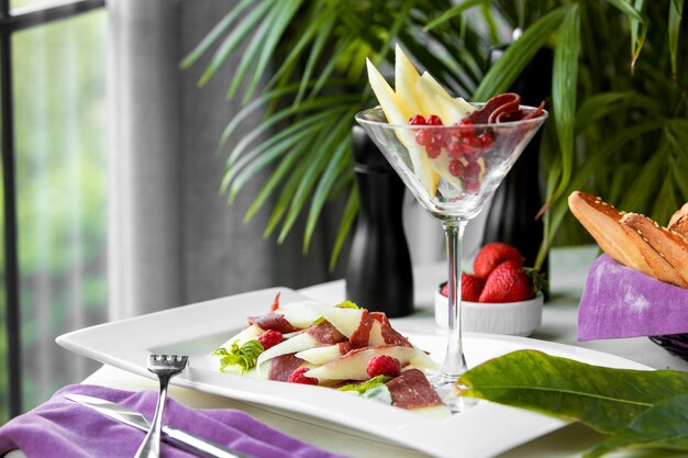 A plate and glass with mixed food