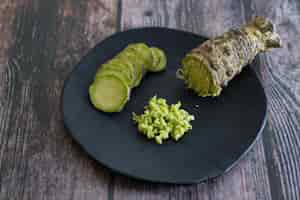 Free photo plate of japanese horseradish or wasabi on a wooden table