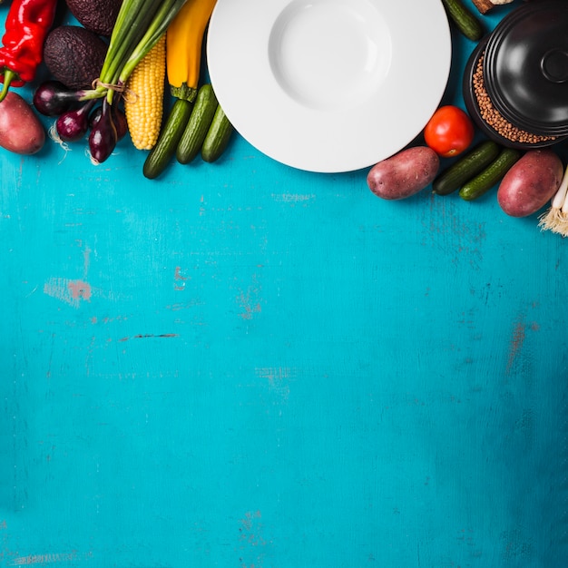 Plate and raw vegetables