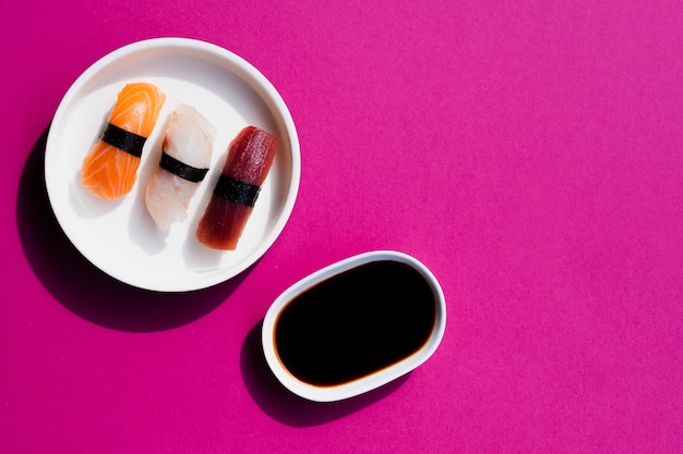 Plate of sushi with soy sauce jar