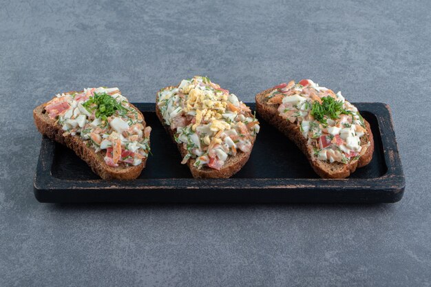 Plate of toast bread with fresh salad