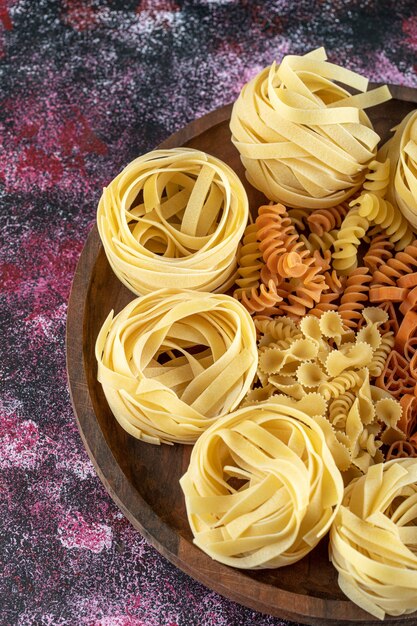 Plate of various macaroni on colorful background. High quality photo