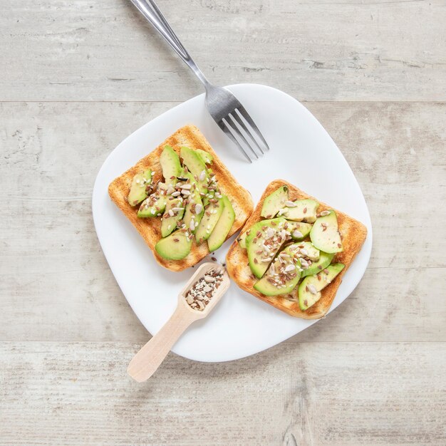 Plate with avocado and seeds toast