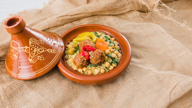 Plate with fresh food on burlap