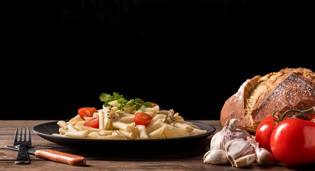 Plate with italian pasta and bread