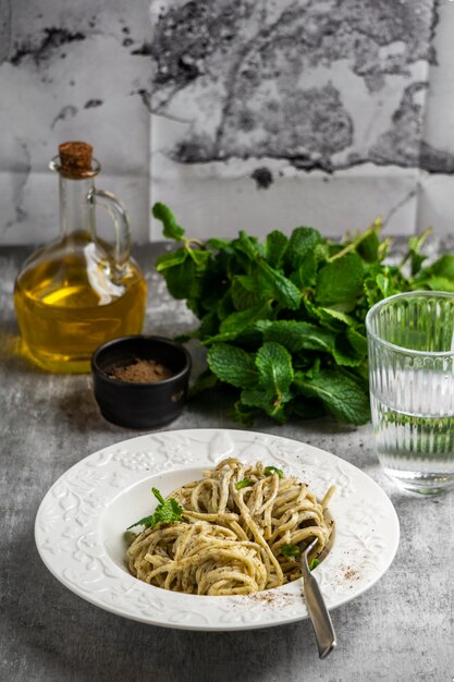 Plate with pasta and herbs