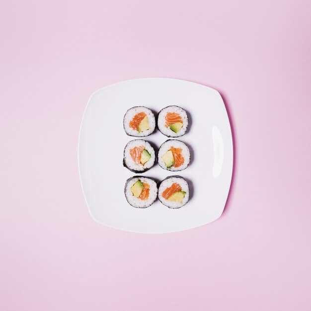 Plate with sushi on pink