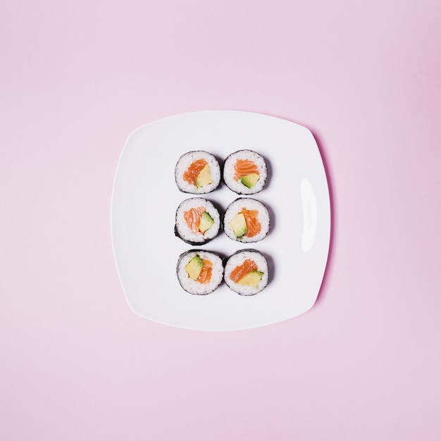 Plate with sushi on pink