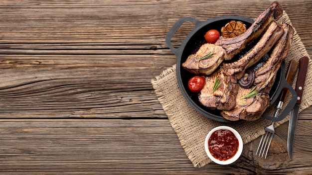 Plate with tasty meat and sauce with copy-space