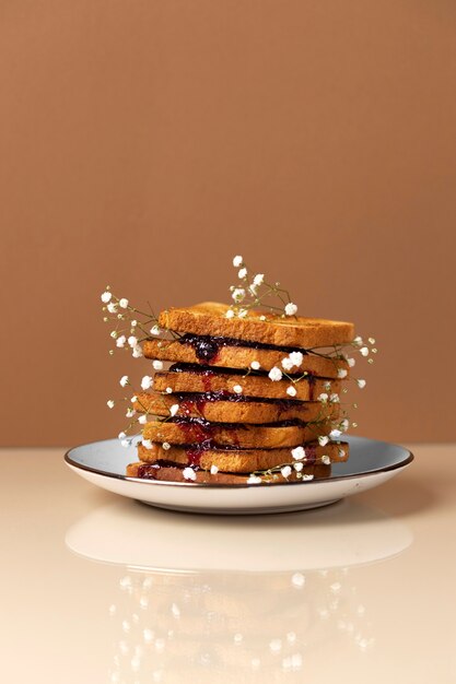 Plate with toast and flowers on table