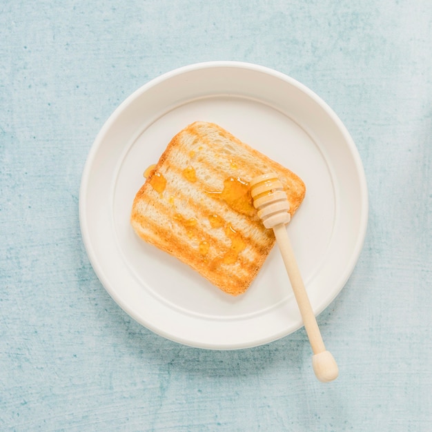 Plate with toast and honey