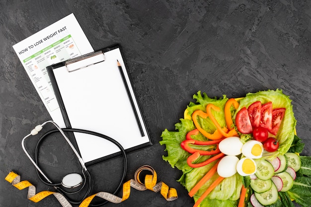 Plateau of healthy food with clipboard