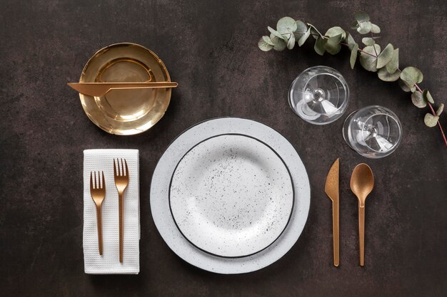 Plates, cutlery and glasses above view