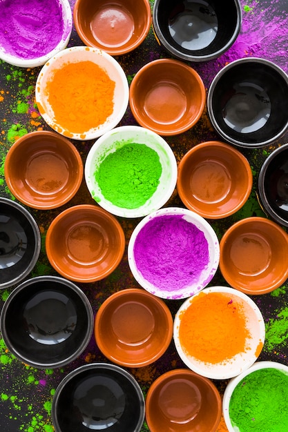 Plates with powders and bowls on table