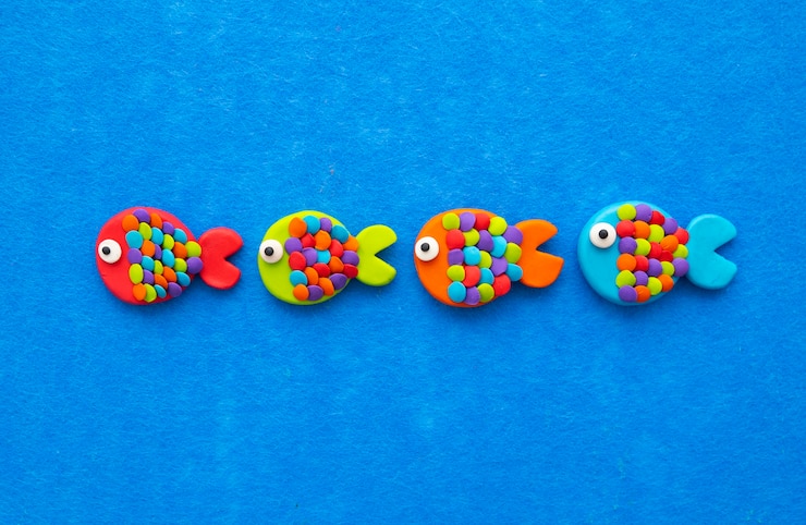Free Photo play dough background with cute fish