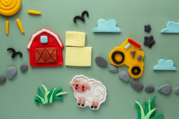 Playdough art with barn and sheep