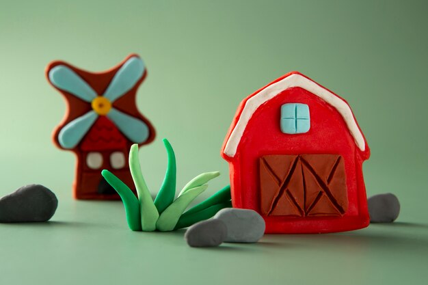 Playdough art with barn and windmill