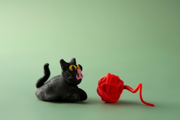 Free photo playdough art with cat and yarn ball