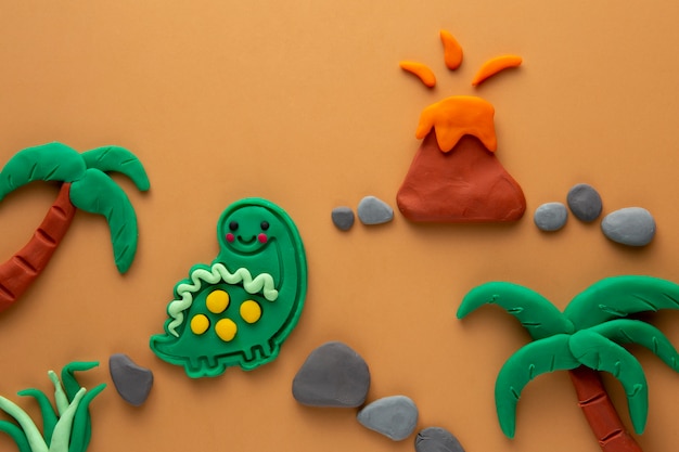 Playdough art with dinosaur and volcano