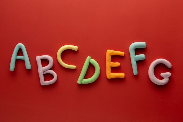 Free photo playdough art with letters flat lay