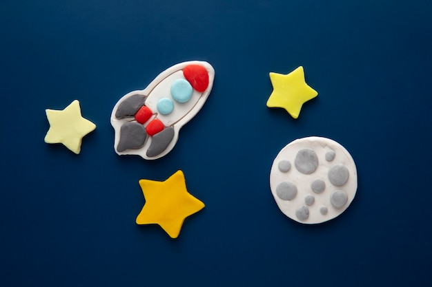 Free photo playdough art with rocket and moon