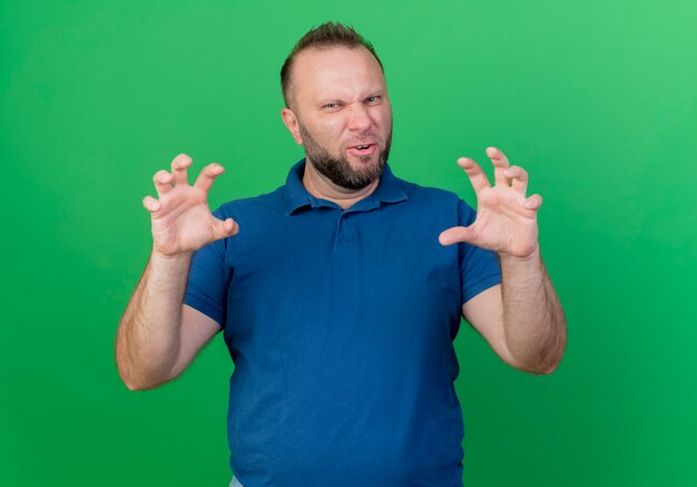 Playful adult slavic man doing tiger paws gesture 